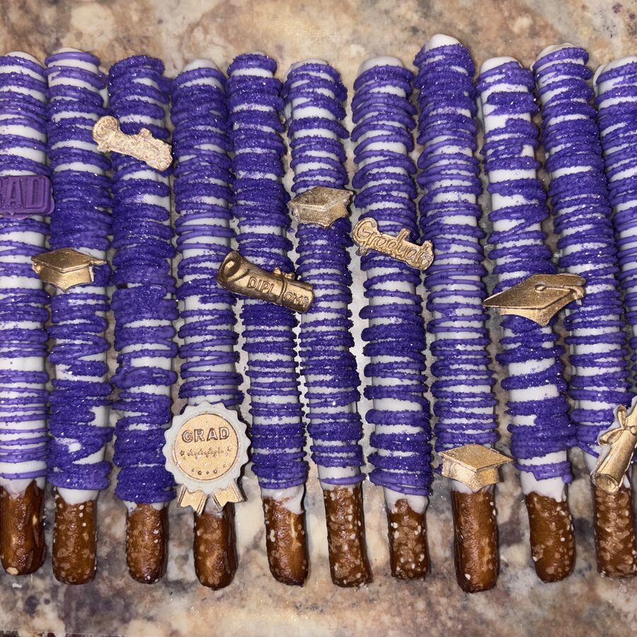Purple and gold graduation pretzel rods